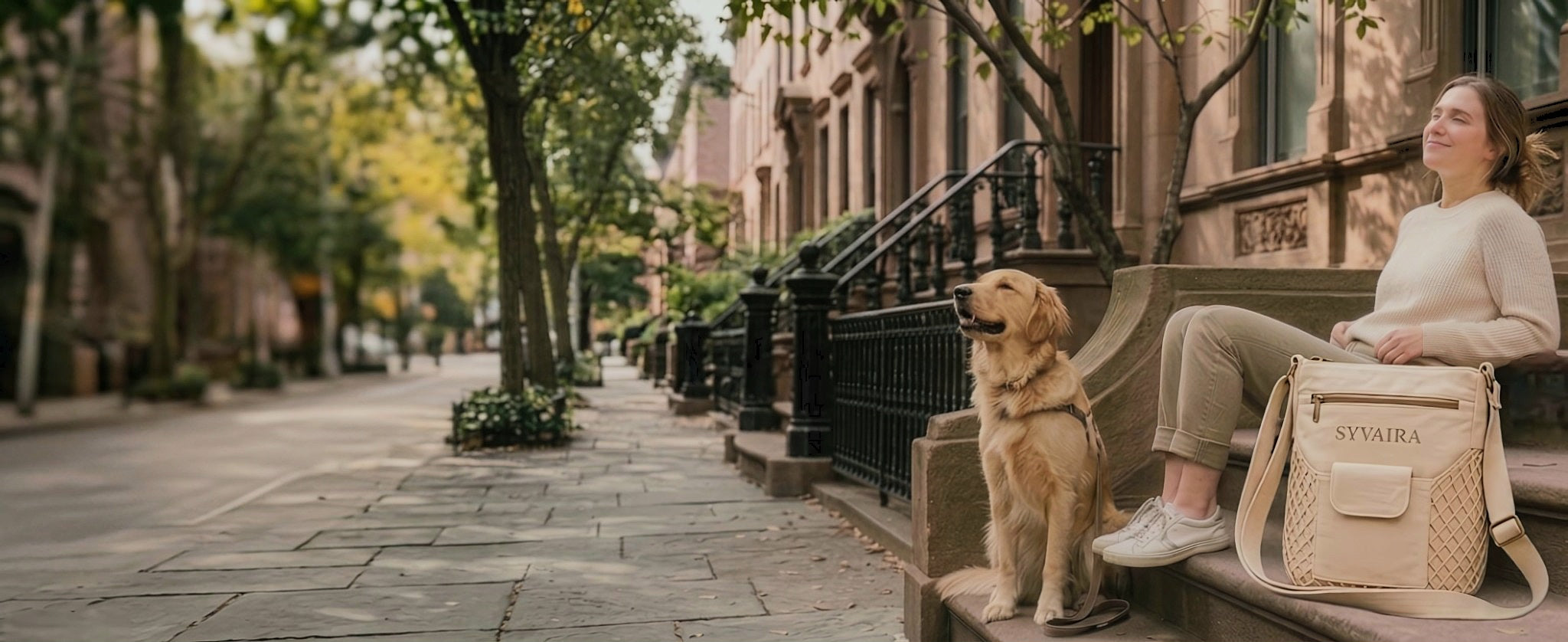 SYVAIRA Walk Companion crossbody bag worn on Brooklyn brownstone steps with golden retriever